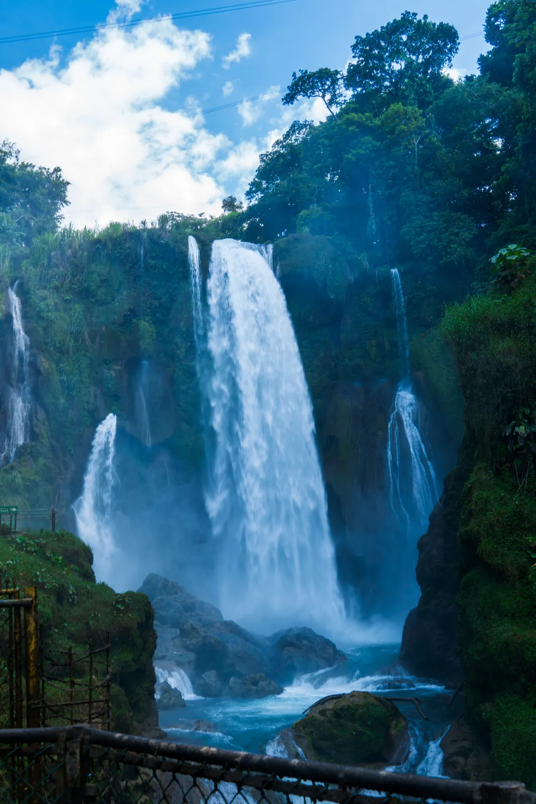 Blue waterfall in a forest in Honduras