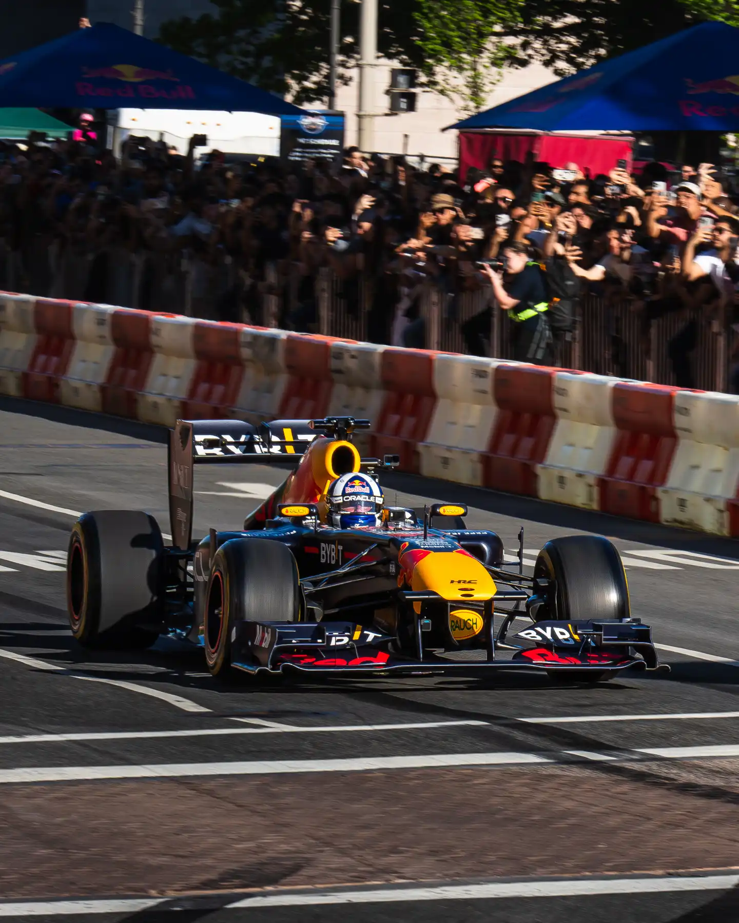 F1 car racing down road in Washington, DC by Antlophotography