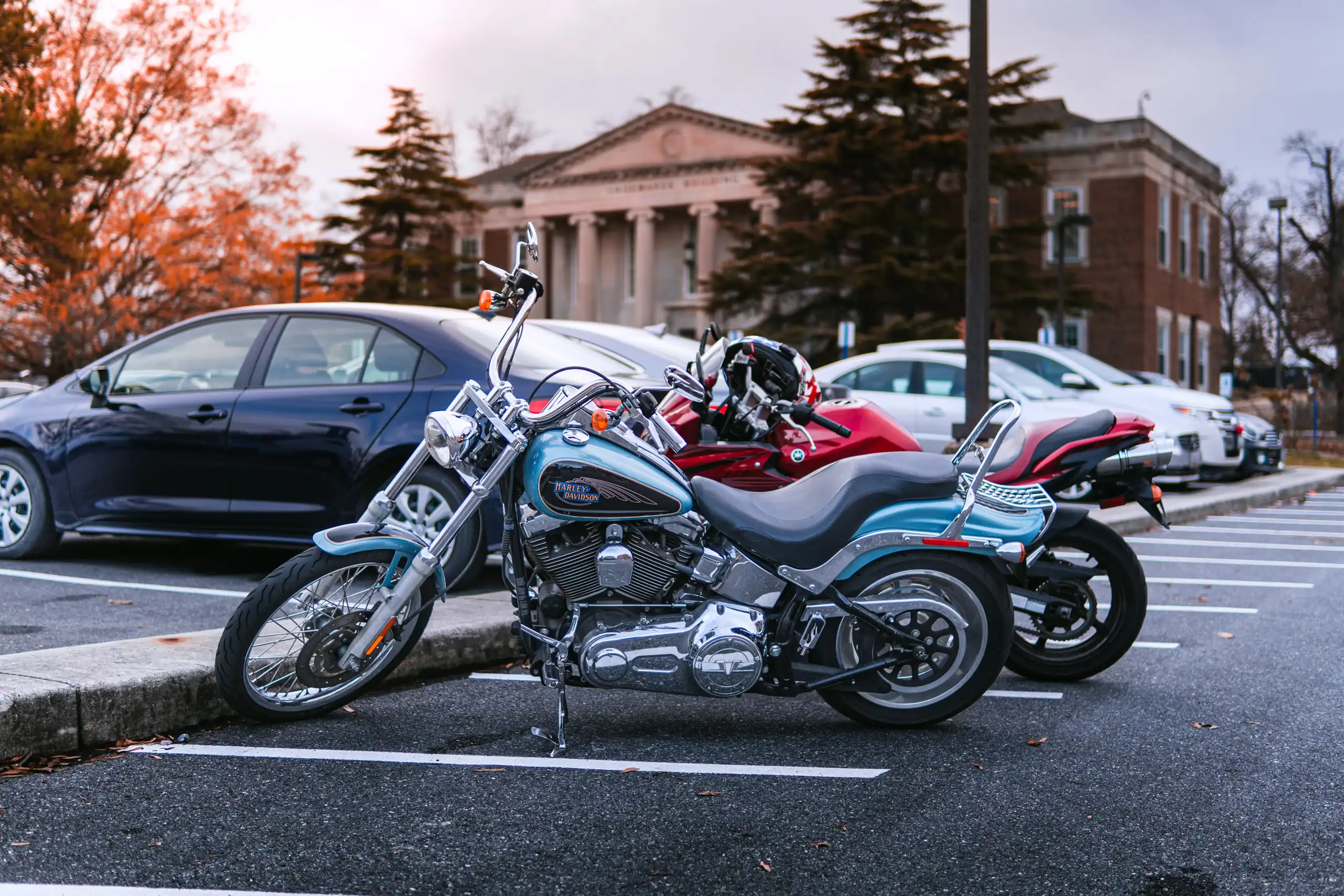 Light Blue Harley Davidson Motorcycle in parking lot in Maryland by Antlophotography