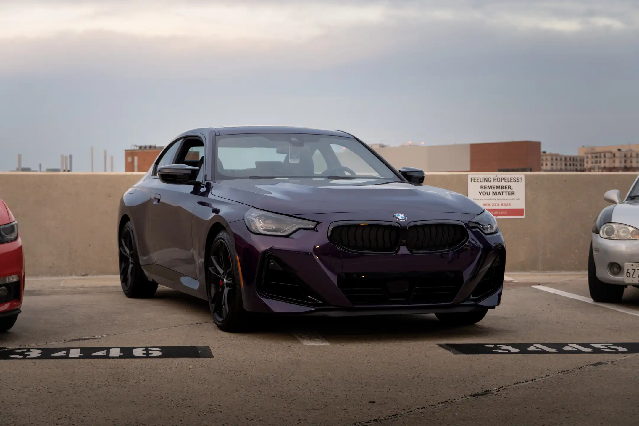 Horizontal image of Purple BMW on parking garage with beautiful sky background in Maryland by Antlophotography