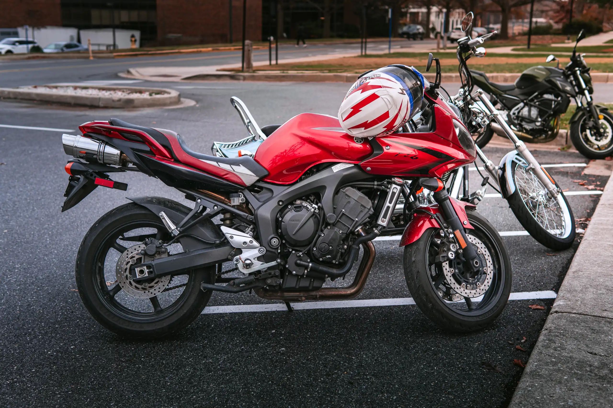 Red Yamaha FZ6 in parking lot in Maryland by Antlophotography